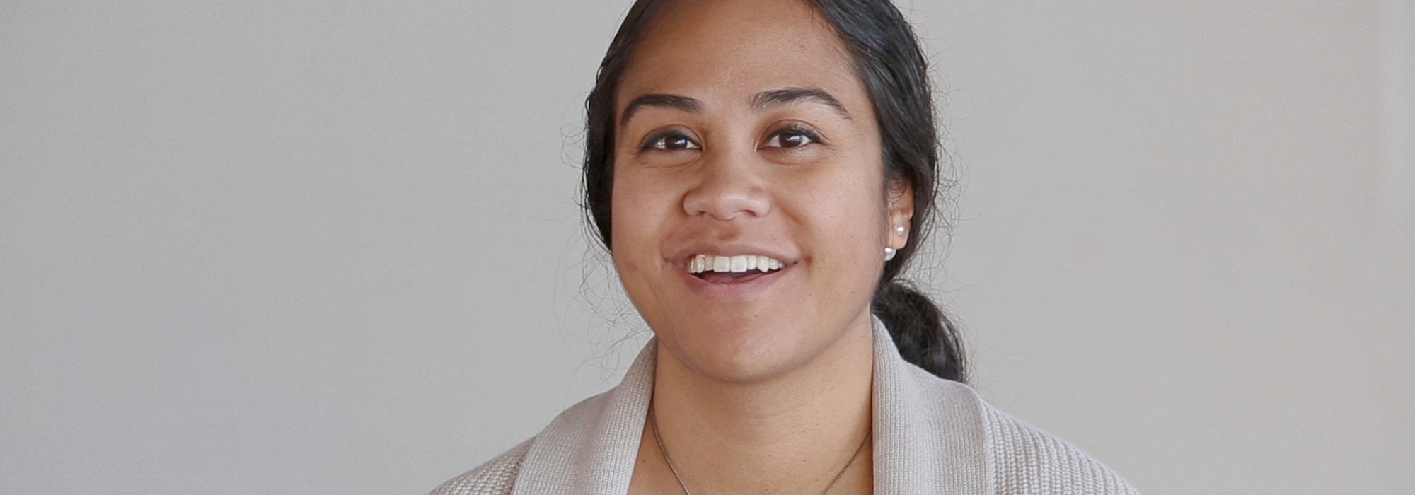 Islander young woman looking into the camera and smiling