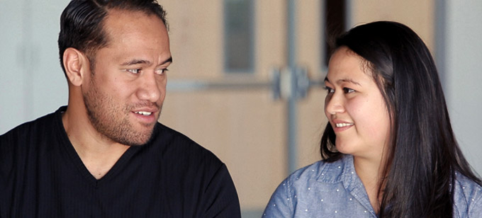 Islander man and woman looking at each other