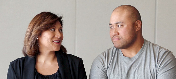 Islander man and woman looking at each other