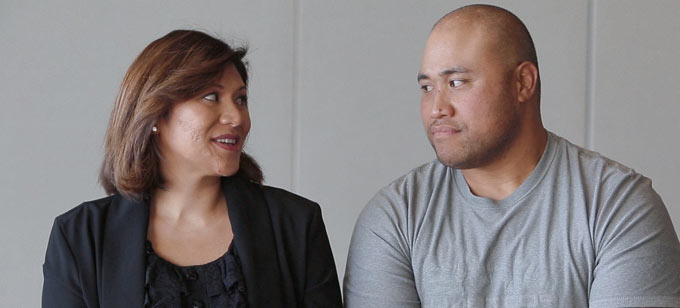 Islander man and woman looking at each other